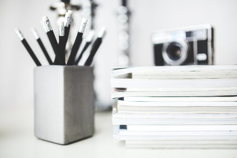 paper and pencils on desk