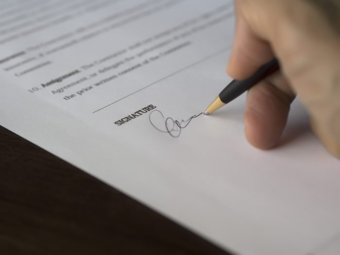 signing a contract document