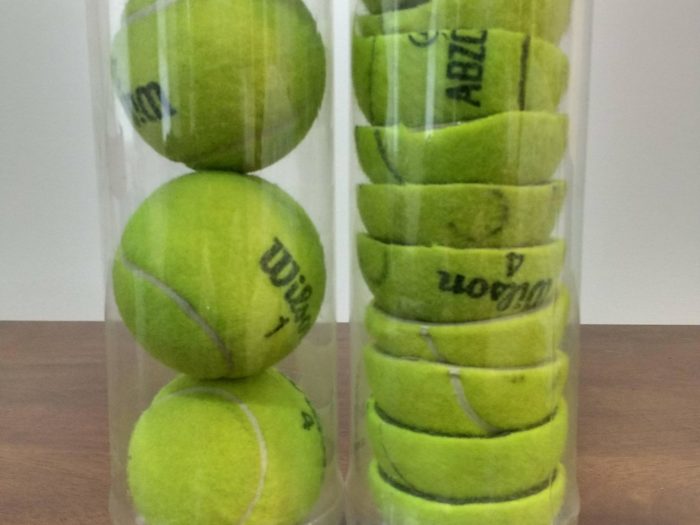 cans of cut and full tennis balls