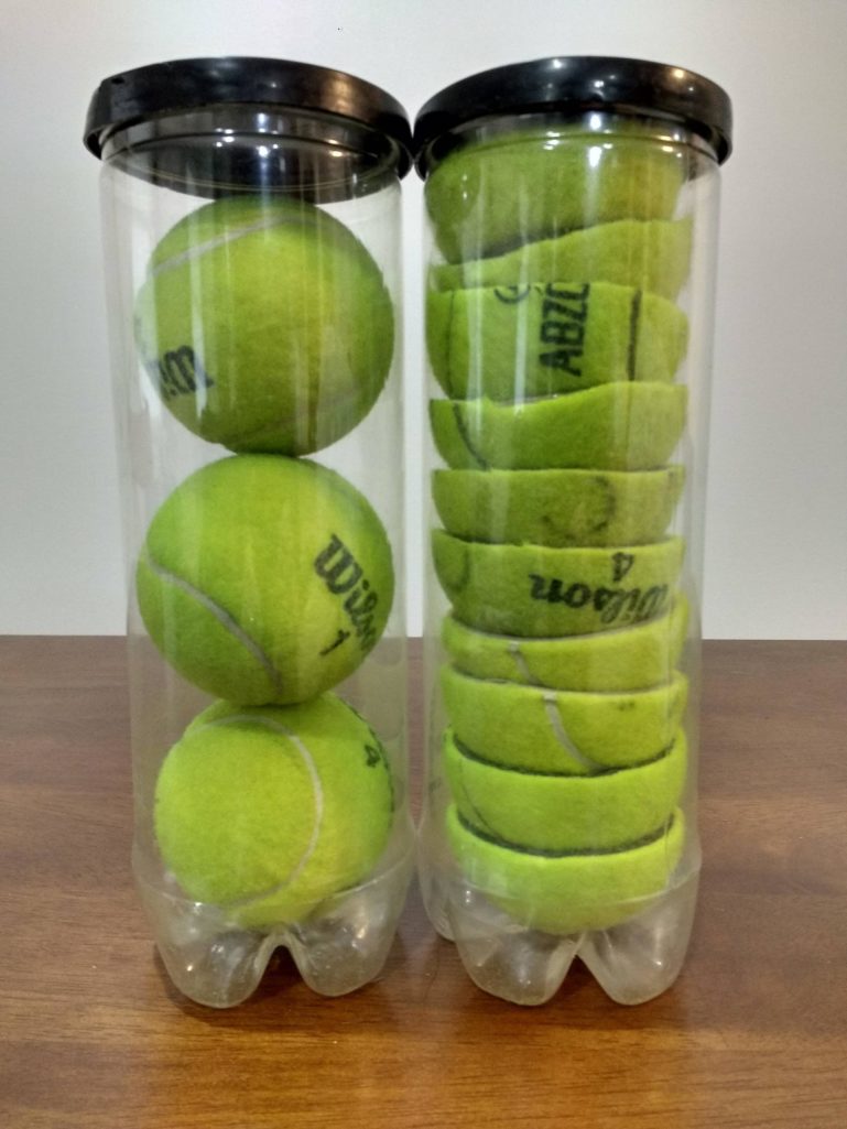 cans of cut and full tennis balls