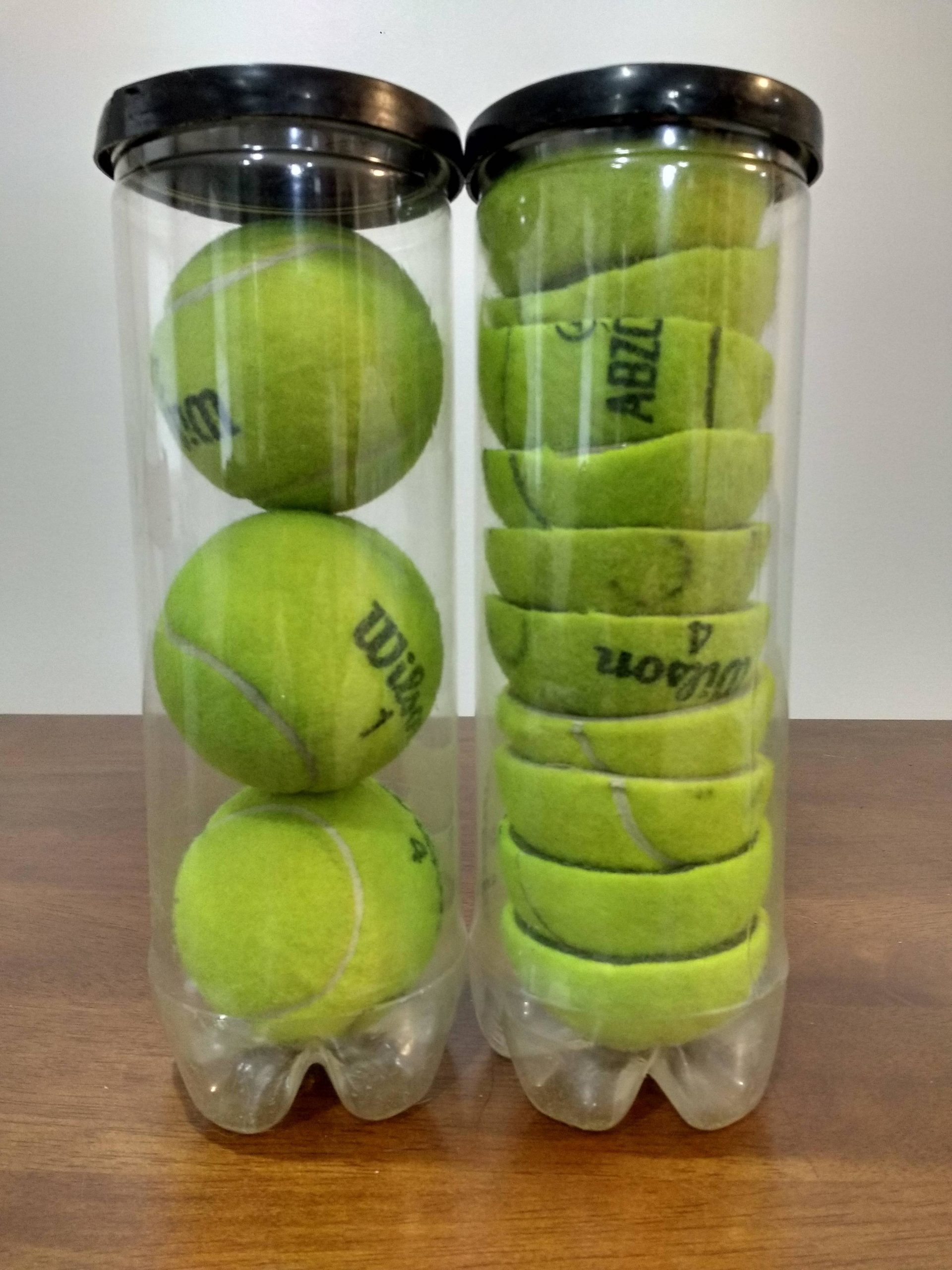 cans of cut and full tennis balls